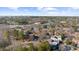 An aerial view showcasing the community's layout and proximity to nearby amenities, including mature trees at 3091 Colonial Way # E4, Chamblee, GA 30341