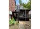 Brick building exterior with an outdoor deck, steps, and landscaping at 3091 Colonial Way # E4, Chamblee, GA 30341