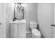 Stylish bathroom features a modern vanity, toilet, and patterned tile flooring at 3091 Colonial Way # E4, Chamblee, GA 30341