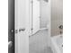 Partial view of remodeled bathroom with stylish tile flooring and white fixtures at 3091 Colonial Way # E4, Chamblee, GA 30341