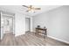 A bedroom showcasing a small desk, closet, ceiling fan and ensuite bathroom at 3091 Colonial Way # E4, Chamblee, GA 30341