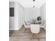 Cozy dining room features seating for four and modern light fixture at 3091 Colonial Way # E4, Chamblee, GA 30341