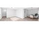 Open living and dining space with grey walls, modern light fixtures and light wood floors at 3091 Colonial Way # E4, Chamblee, GA 30341