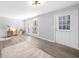 Open concept living room boasts lots of natural light from the sliding glass door at 3091 Colonial Way # E4, Chamblee, GA 30341