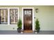 Elegant dark wood front door with glass panels and sidelights at 425 Hardendorf Ne Ave, Atlanta, GA 30307