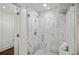 Large walk-in shower with marble tile and glass enclosure at 425 Hardendorf Ne Ave, Atlanta, GA 30307