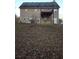 Back view of house with a deck and a spacious backyard at 95 Jenna Ln, Covington, GA 30016