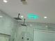 Modern bathroom featuring double shower heads, tiled walls, and recessed lighting at 95 Jenna Ln, Covington, GA 30016