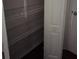 Bedroom closet with metal rack shelving for storage at 95 Jenna Ln, Covington, GA 30016