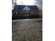 Charming single-Gathering home featuring a cozy porch and well-maintained front yard landscaping at 95 Jenna Ln, Covington, GA 30016