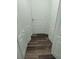 Hallway featuring multiple doors and plank flooring at 95 Jenna Ln, Covington, GA 30016