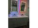 Bathroom vanity with double sinks, backlit mirrors, and plenty of storage space at 95 Jenna Ln, Covington, GA 30016