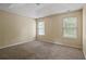 Spacious bedroom with neutral walls and carpet flooring at 9129 Jefferson Village Sw Dr, Covington, GA 30014