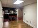 Basement bar with black cabinetry and red and black checkered floor at 1417 Doe Valley Dr, Lithonia, GA 30058