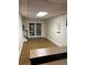 Spacious basement room with French doors and hardwood floor at 1417 Doe Valley Dr, Lithonia, GA 30058