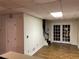 Bright basement room with hardwood floors and French doors at 1417 Doe Valley Dr, Lithonia, GA 30058