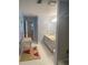 Light blue bathroom with double vanity and tiled floors at 1417 Doe Valley Dr, Lithonia, GA 30058