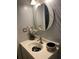 Small bathroom with pedestal sink and decorative accents at 1417 Doe Valley Dr, Lithonia, GA 30058