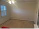 Bright bedroom featuring a large window and neutral wall colors at 1417 Doe Valley Dr, Lithonia, GA 30058
