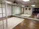 Dance studio with wood floors, mirrors, and a ceiling fan at 1417 Doe Valley Dr, Lithonia, GA 30058