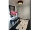 Bright foyer with black and white tile floor, a console table, and a large mirror at 1417 Doe Valley Dr, Lithonia, GA 30058