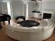 Living room with a curved sofa and hardwood floors at 1417 Doe Valley Dr, Lithonia, GA 30058