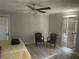 Main bedroom with yellow bedding and two armchairs at 1417 Doe Valley Dr, Lithonia, GA 30058