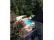Inviting in-ground pool with surrounding deck and lush greenery at 1417 Doe Valley Dr, Lithonia, GA 30058