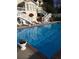 Sparkling blue pool with brick coping and surrounding patio at 1417 Doe Valley Dr, Lithonia, GA 30058