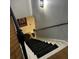 Stairs leading downstairs with black carpeting and wooden handrail at 1417 Doe Valley Dr, Lithonia, GA 30058