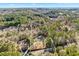 Aerial view showing home's location on wooded lot at 3133 Callie Still Rd, Lawrenceville, GA 30045