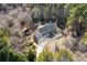 Aerial view of house with large backyard and wooded area at 3133 Callie Still Rd, Lawrenceville, GA 30045