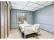 Small basement bedroom with a twin bed and window at 3133 Callie Still Rd, Lawrenceville, GA 30045