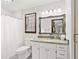 Clean bathroom with granite countertop, single vanity, and shower/tub combo at 3133 Callie Still Rd, Lawrenceville, GA 30045