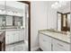 Bathroom with granite countertop, double vanity, and a large mirror at 3133 Callie Still Rd, Lawrenceville, GA 30045