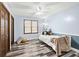 Cozy bedroom with light blue walls and wood flooring at 3133 Callie Still Rd, Lawrenceville, GA 30045