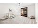 Bright Bedroom with crib, carpet, and sliding glass doors leading to a deck at 3133 Callie Still Rd, Lawrenceville, GA 30045