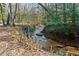 Small creek flows through a wooded area at 3133 Callie Still Rd, Lawrenceville, GA 30045