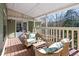 Relaxing deck with wicker furniture and wooded views at 3133 Callie Still Rd, Lawrenceville, GA 30045