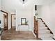 Bright entryway with hardwood floors and staircase to the upper level at 3133 Callie Still Rd, Lawrenceville, GA 30045
