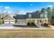 Charming house with a wraparound porch and attached two-car garage at 3133 Callie Still Rd, Lawrenceville, GA 30045