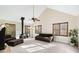 Spacious living room with vaulted ceiling, wood-burning stove, and lots of natural light at 3133 Callie Still Rd, Lawrenceville, GA 30045
