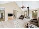 Large living room with vaulted ceiling, wood-burning stove, and lots of natural light at 3133 Callie Still Rd, Lawrenceville, GA 30045