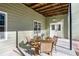 Covered patio with table and chairs, adjacent to home at 3133 Callie Still Rd, Lawrenceville, GA 30045