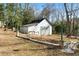 Detached workshop with large doors in backyard at 3133 Callie Still Rd, Lawrenceville, GA 30045