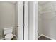 Walk-in closet with carpeted floor, wire shelving, and white trim at 141 Whimsical Ct, Locust Grove, GA 30248