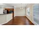 Dining area features a stylish chandelier, bright windows, and easy access to the kitchen at 141 Whimsical Ct, Locust Grove, GA 30248