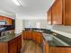 Well-equipped kitchen with stainless steel appliances and a granite island at 141 Whimsical Ct, Locust Grove, GA 30248
