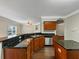 Updated kitchen with a breakfast bar, granite countertops, and stainless steel appliances at 141 Whimsical Ct, Locust Grove, GA 30248