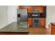 Modern kitchen featuring granite countertops, stainless steel appliances, and dark backsplash at 141 Whimsical Ct, Locust Grove, GA 30248